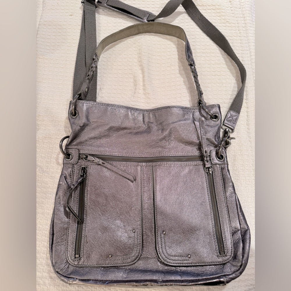 The Sak brand silver crossbody bag